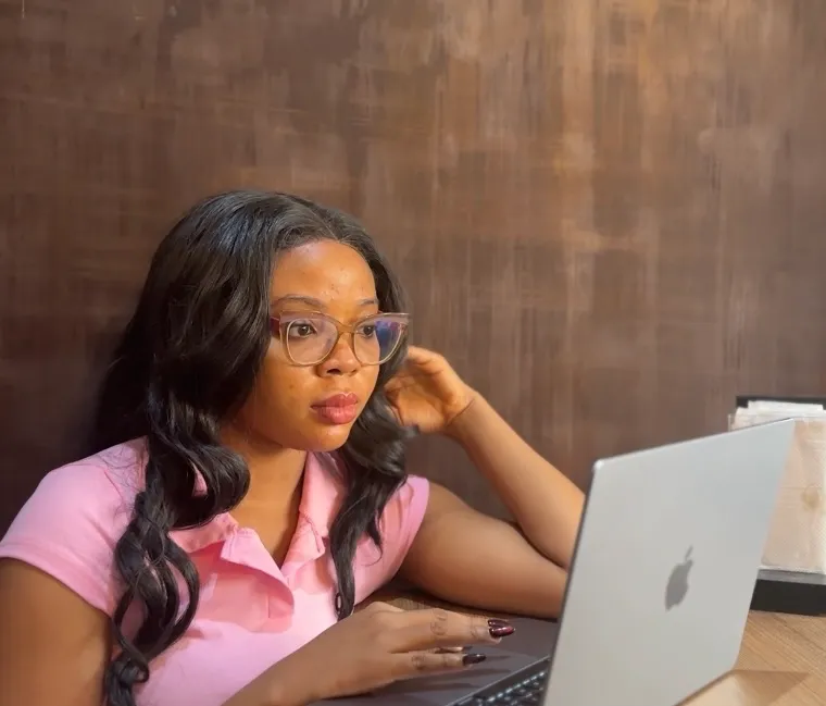 Faith working on her laptop